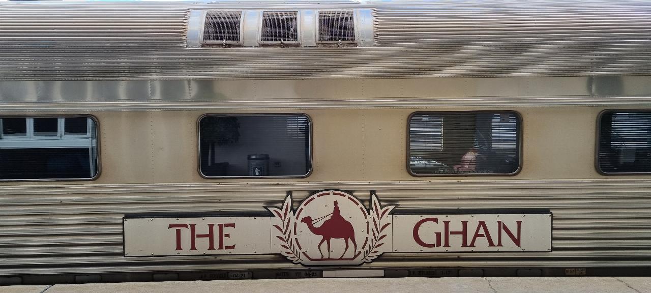 SJR21.d2: the Ghan and logo at station