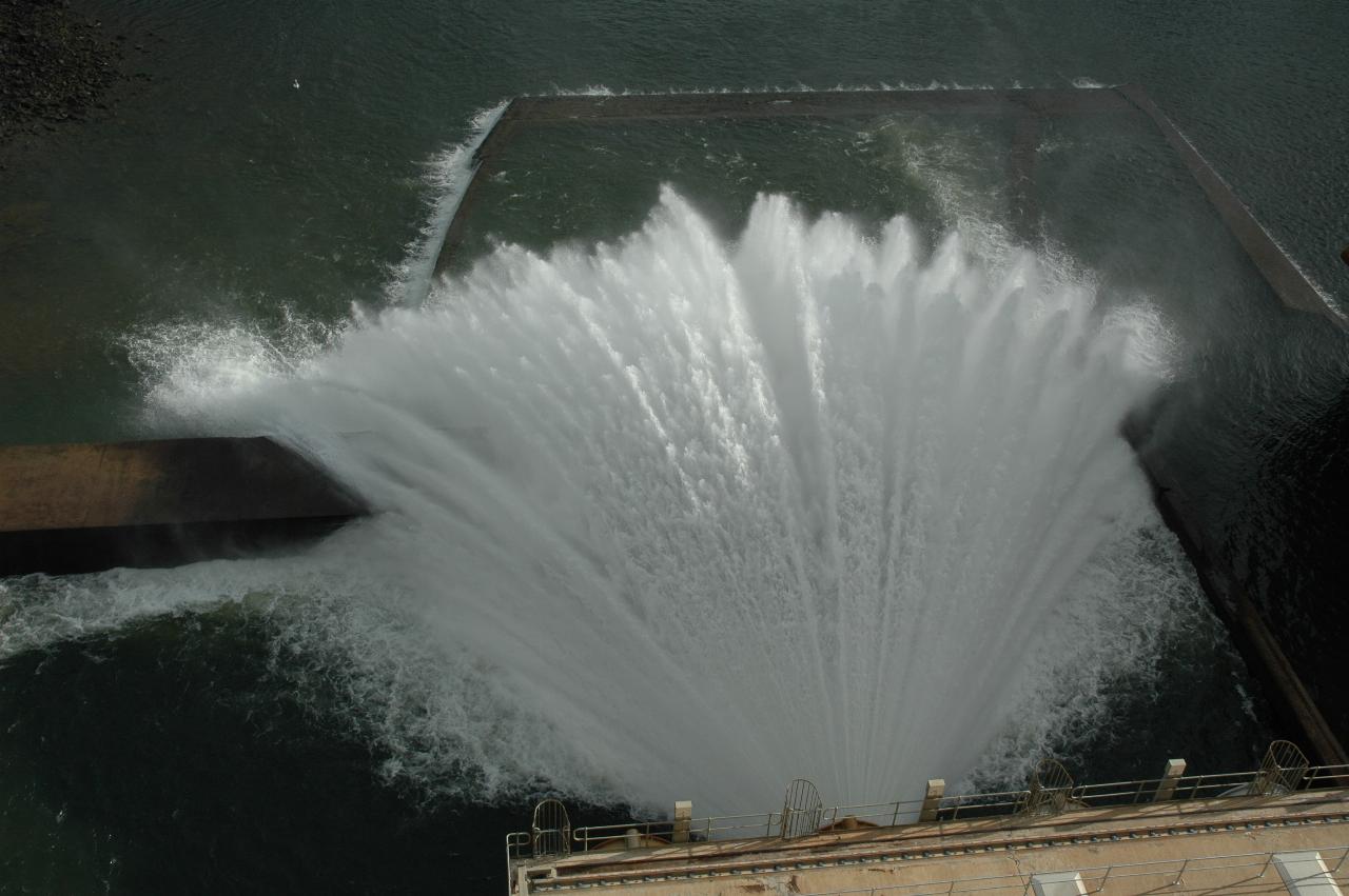 Water coming out of dam wall in fan shape