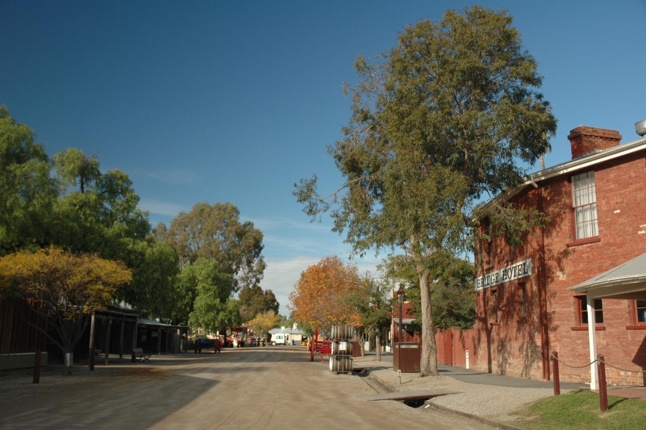 Dirt road with historic flavour and items, including buildings