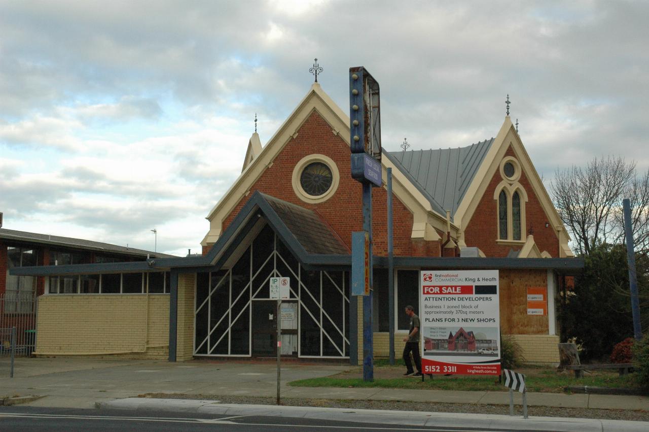 Brick church building, with added front section, and no longer used as a church