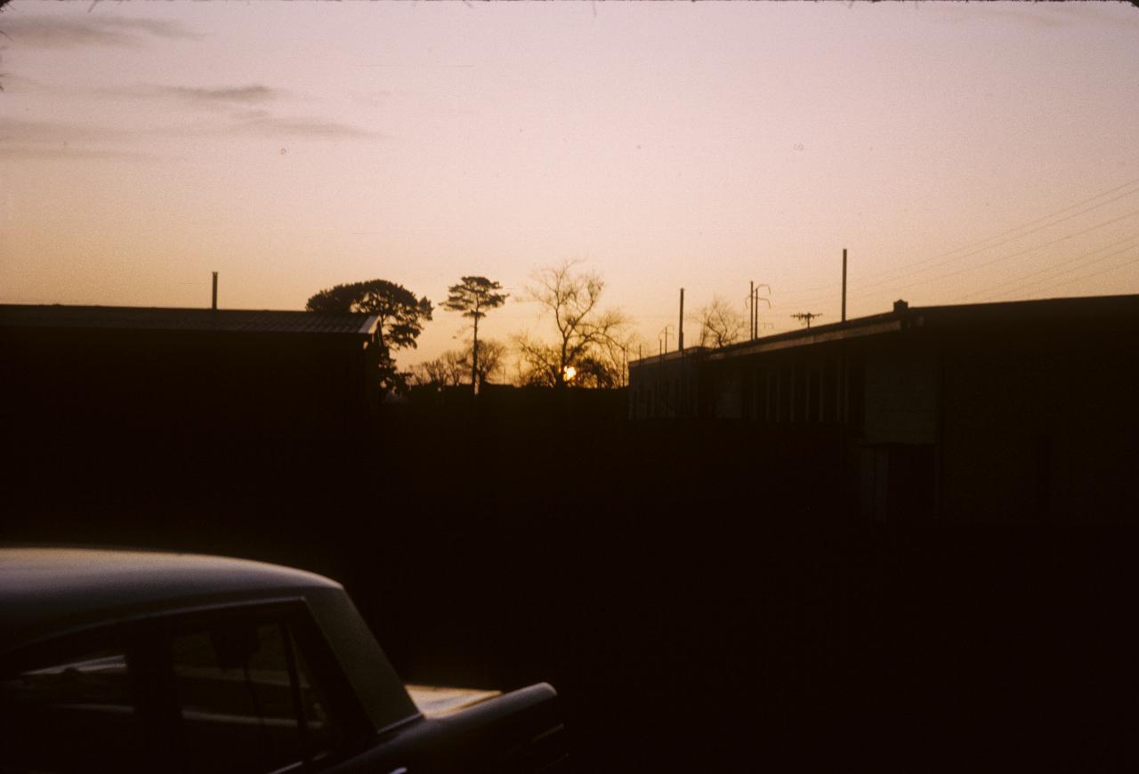 Sunset over car and motel
