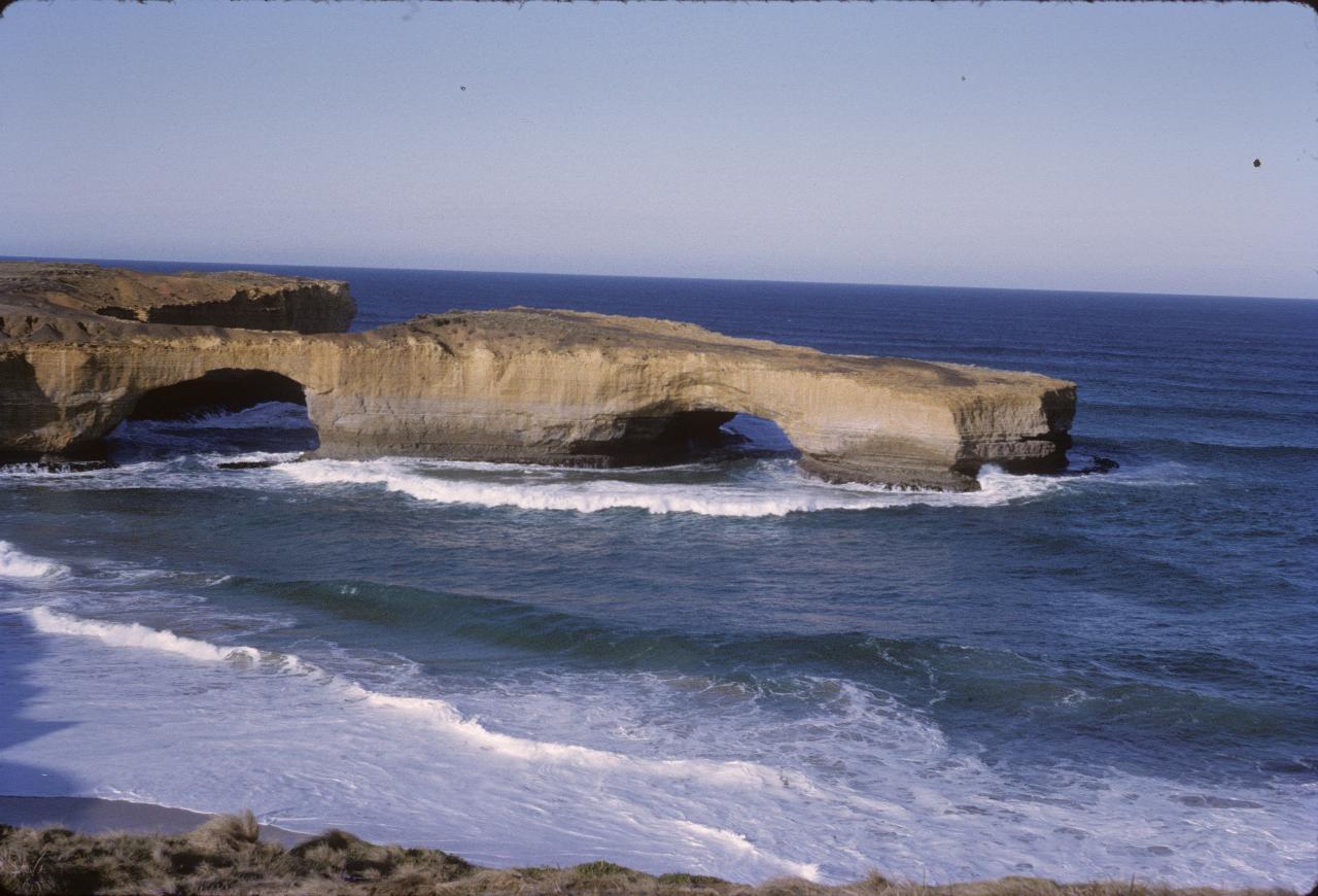Two limestone arches out into the ocean