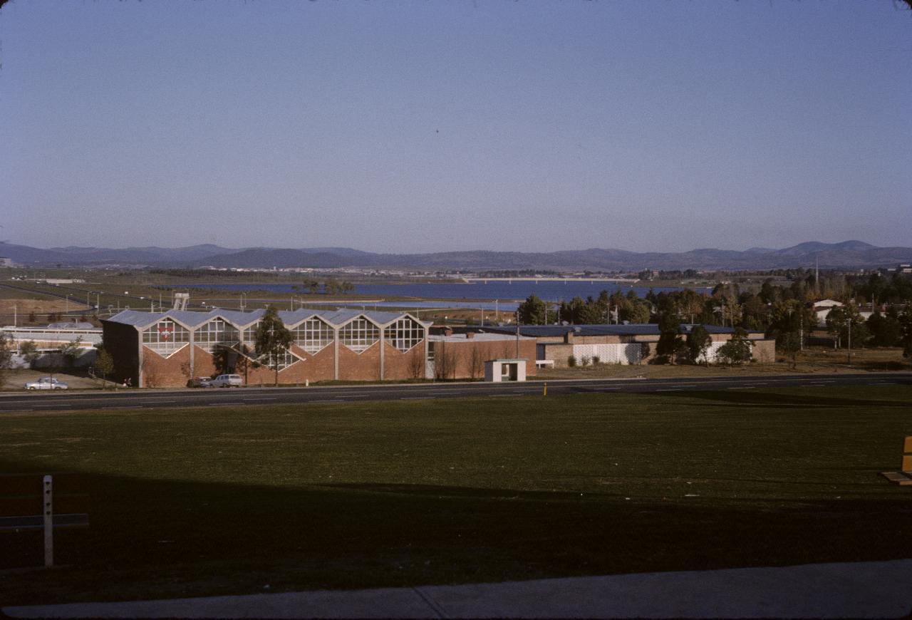 Open space, YMCA building across lake to bridge and distant hills