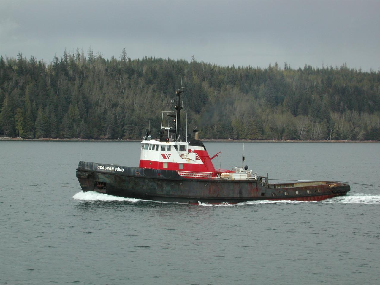 The tug towing the vessel being passed