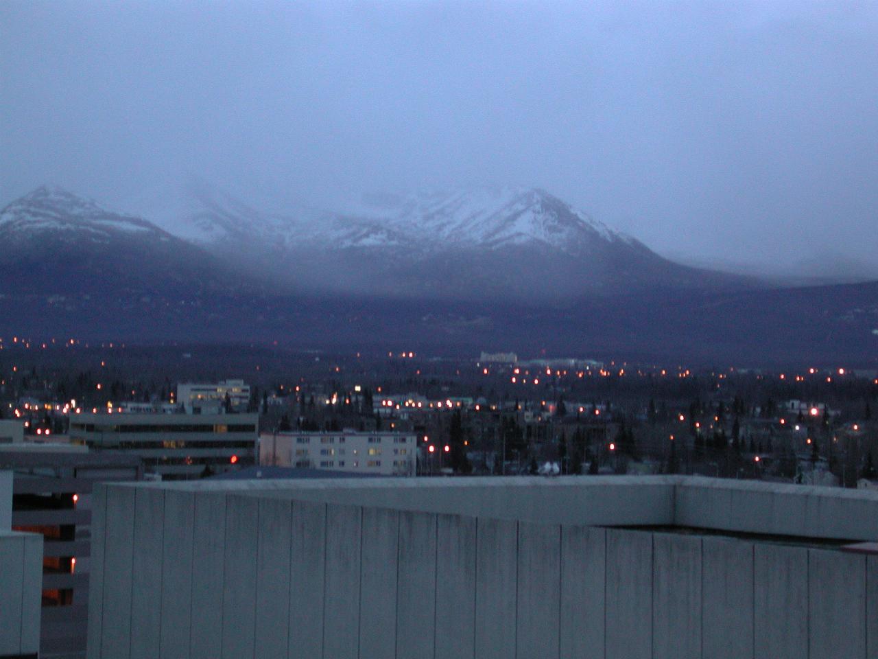 Dusk settles on Anchorage's eastern suburbs and mountains