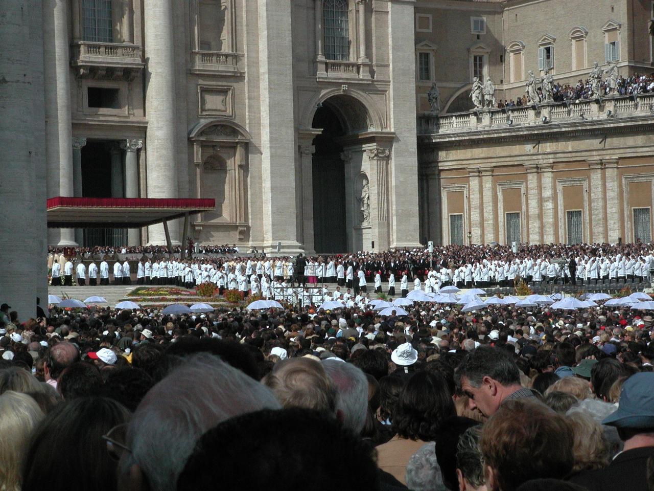 Phalanx of priests walking out to distribute Communion