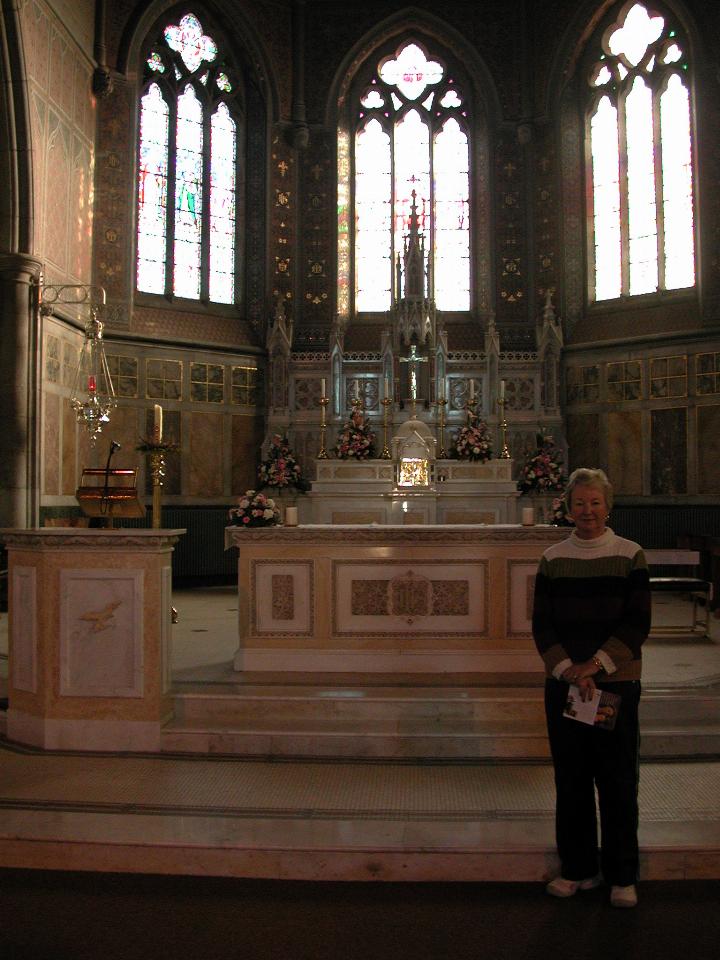 Yvonne in front of altar at St. Patrick's Church, Bandon
