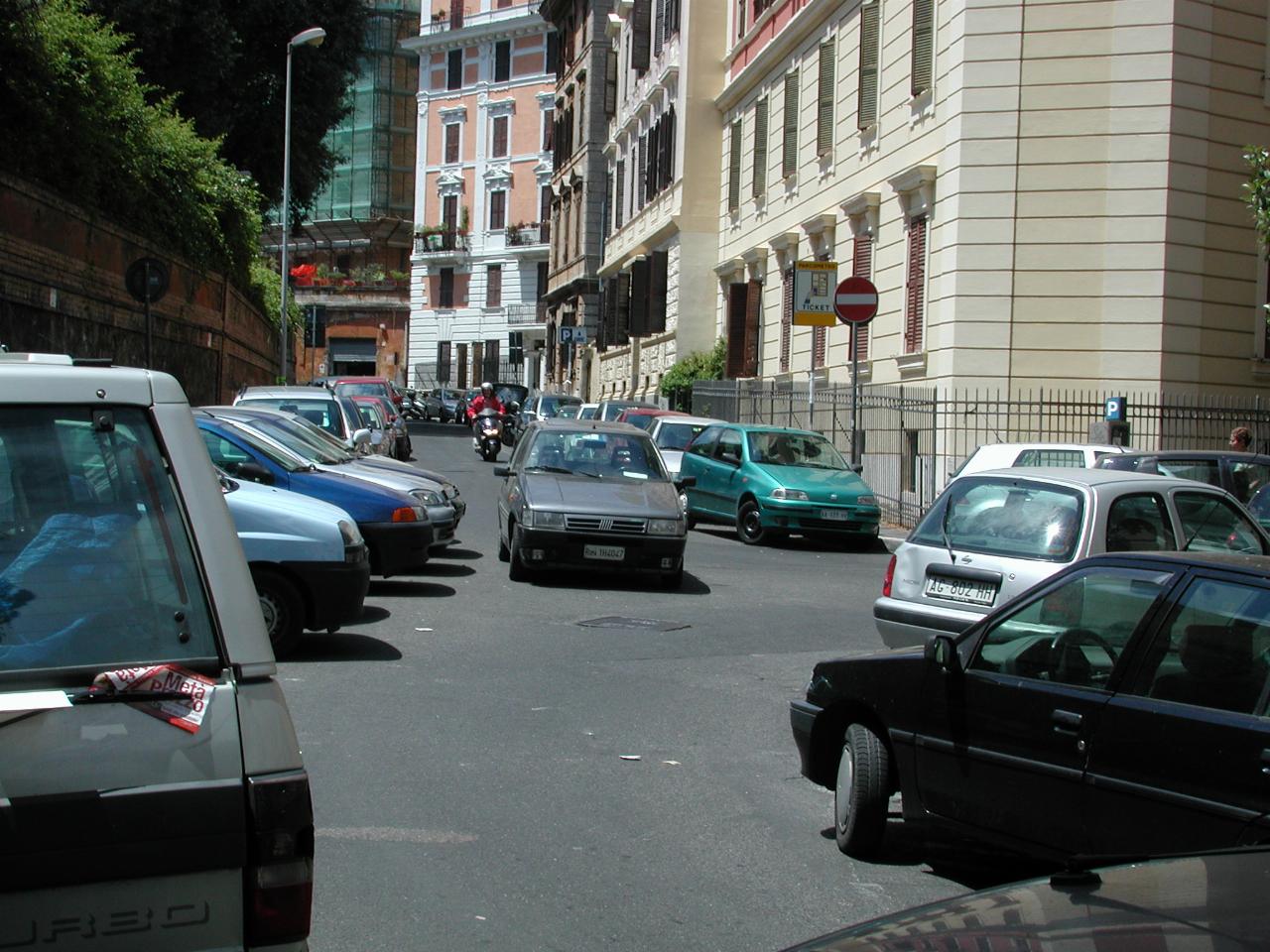 Cars parked everywhere in Rome backstreet