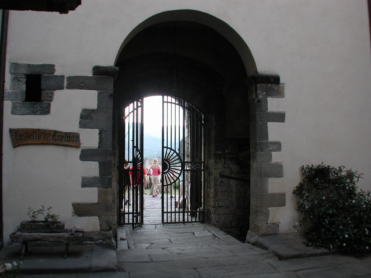 Castello del Trebbio courtyard, looking out to road and hills beyond