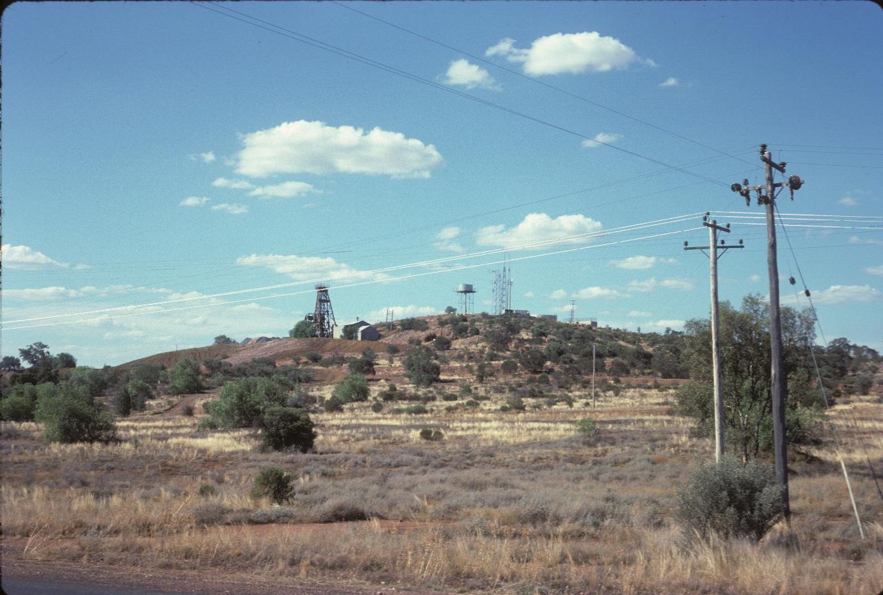 Hill with winding tower, water tank, communications towers