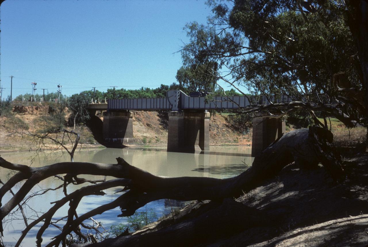 Opening bridge across tan coloured river