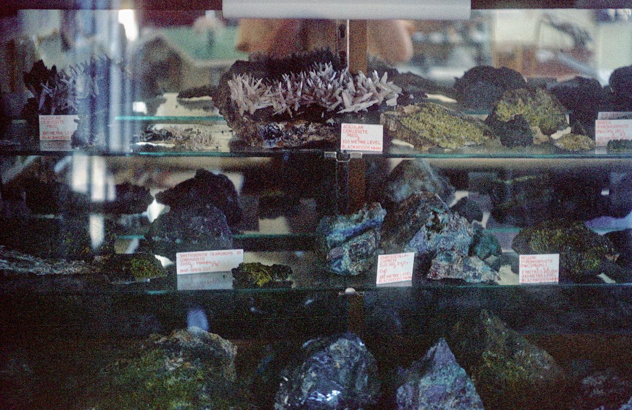 Various crystals and rocks in glass case