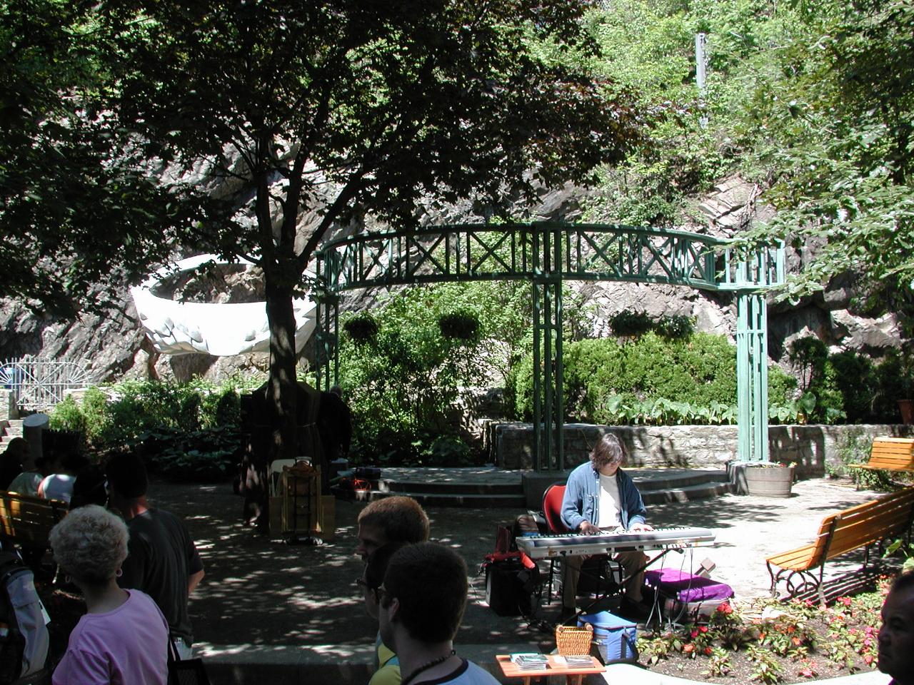 A tiny park, with entertainers, along 
