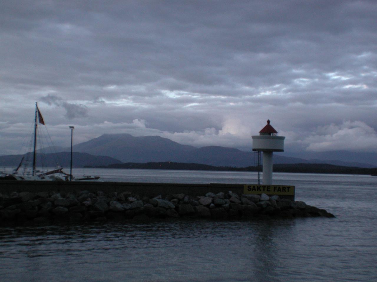 KPLU Viking Jazz: Lighthouse at entrance to yacht basin at Molde; notice wording of sign (means 