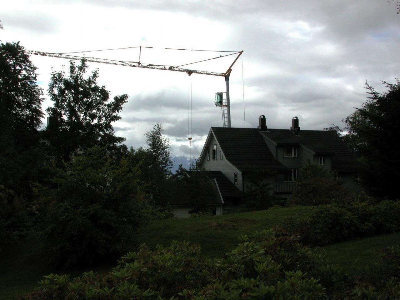 KPLU Viking Jazz: Construction crane amidst city housing as seen from Reknes Park, Molde
