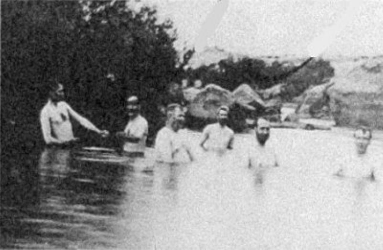 Men in Snowy River at Dalgety