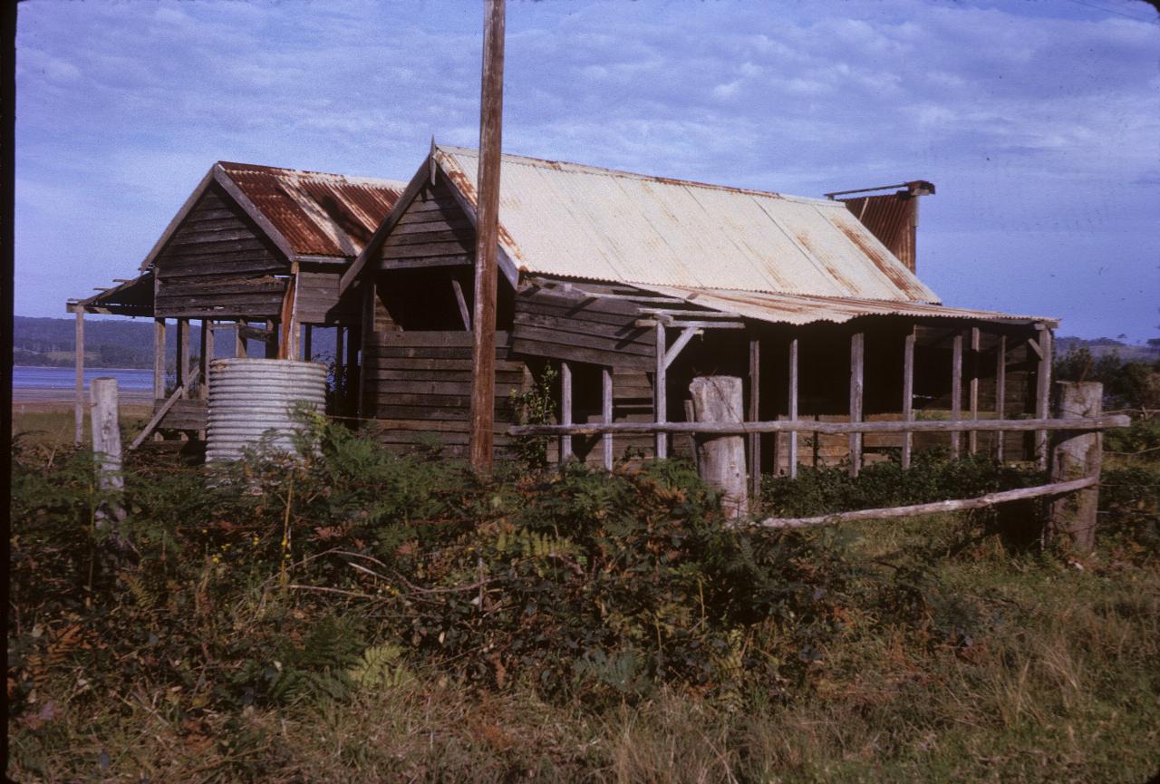 Run down and slowly disintegrating old farm house