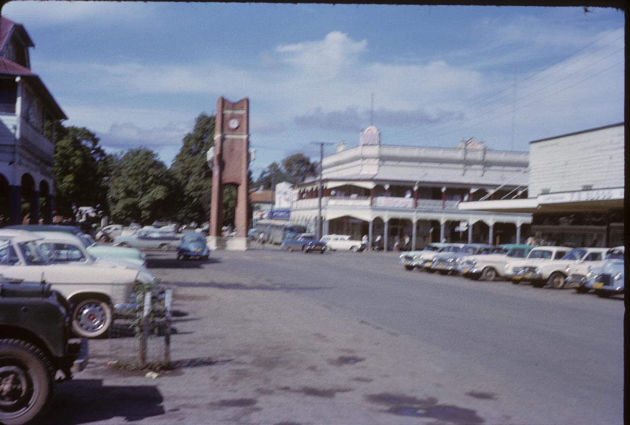 City intersection with brick clock tower in centre