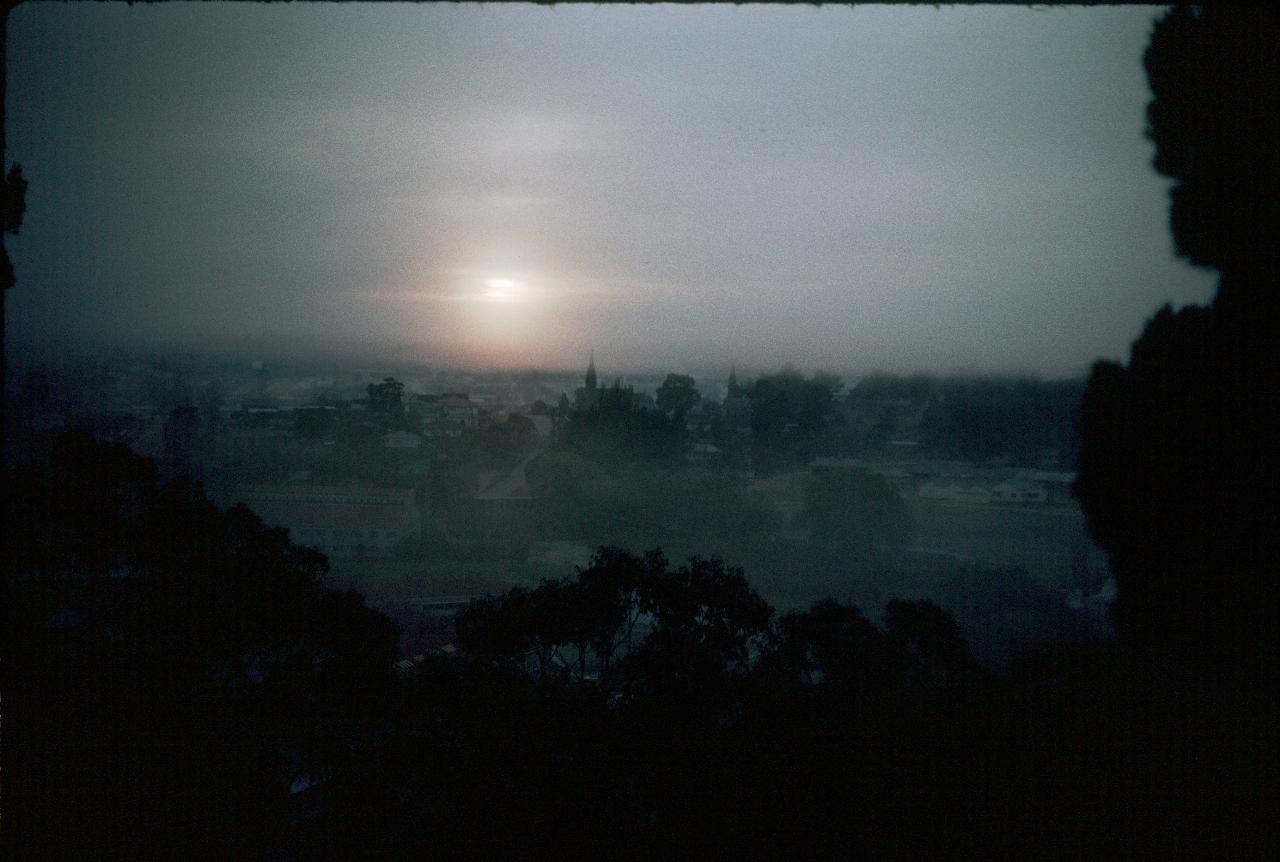 Cloudy sunrise over a township