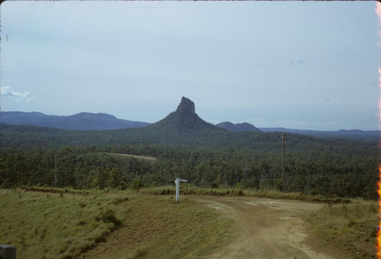 Volcanic plug peak in forested country