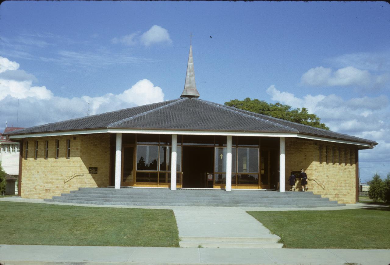 Hexagonal church, light coloured bricks and small spire