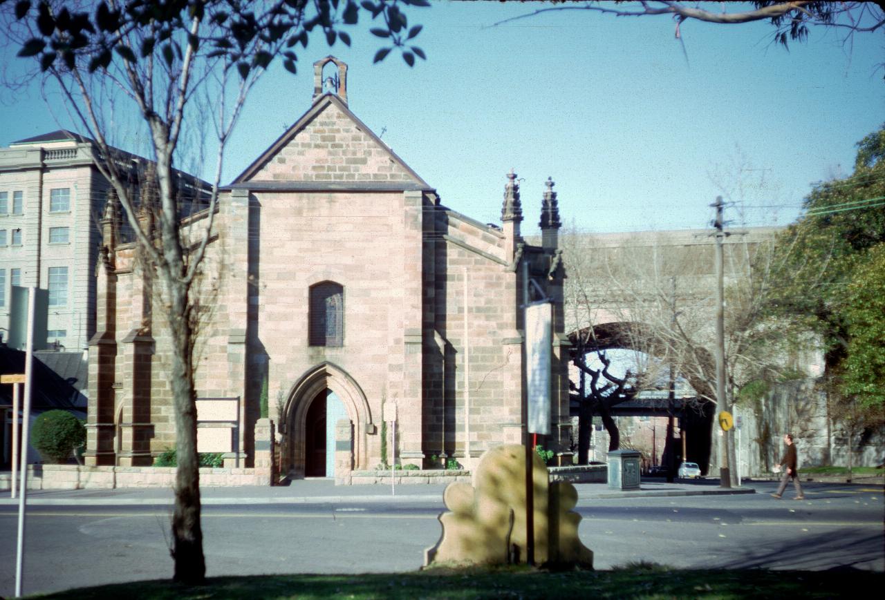 Old stone church beside road tunnel