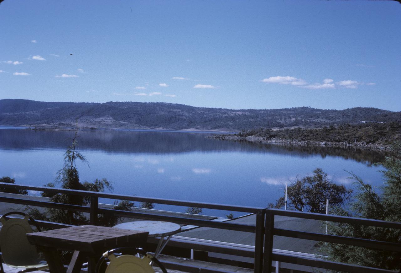 Outdoor eating area looking over lake and distant hills