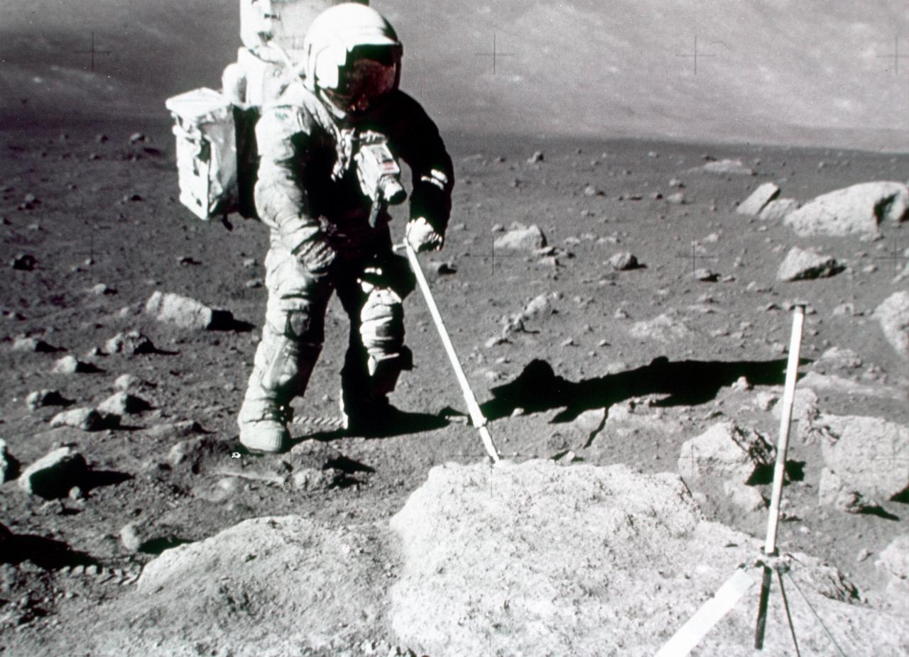 Astronaut with instrument plunged into the surface