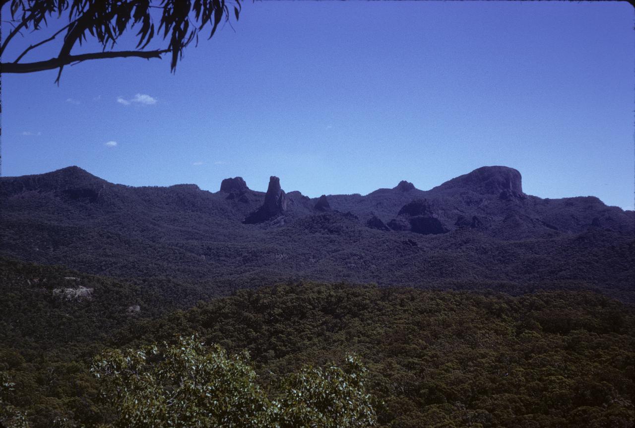 Tree covered valley across to assorted volcanic plugs