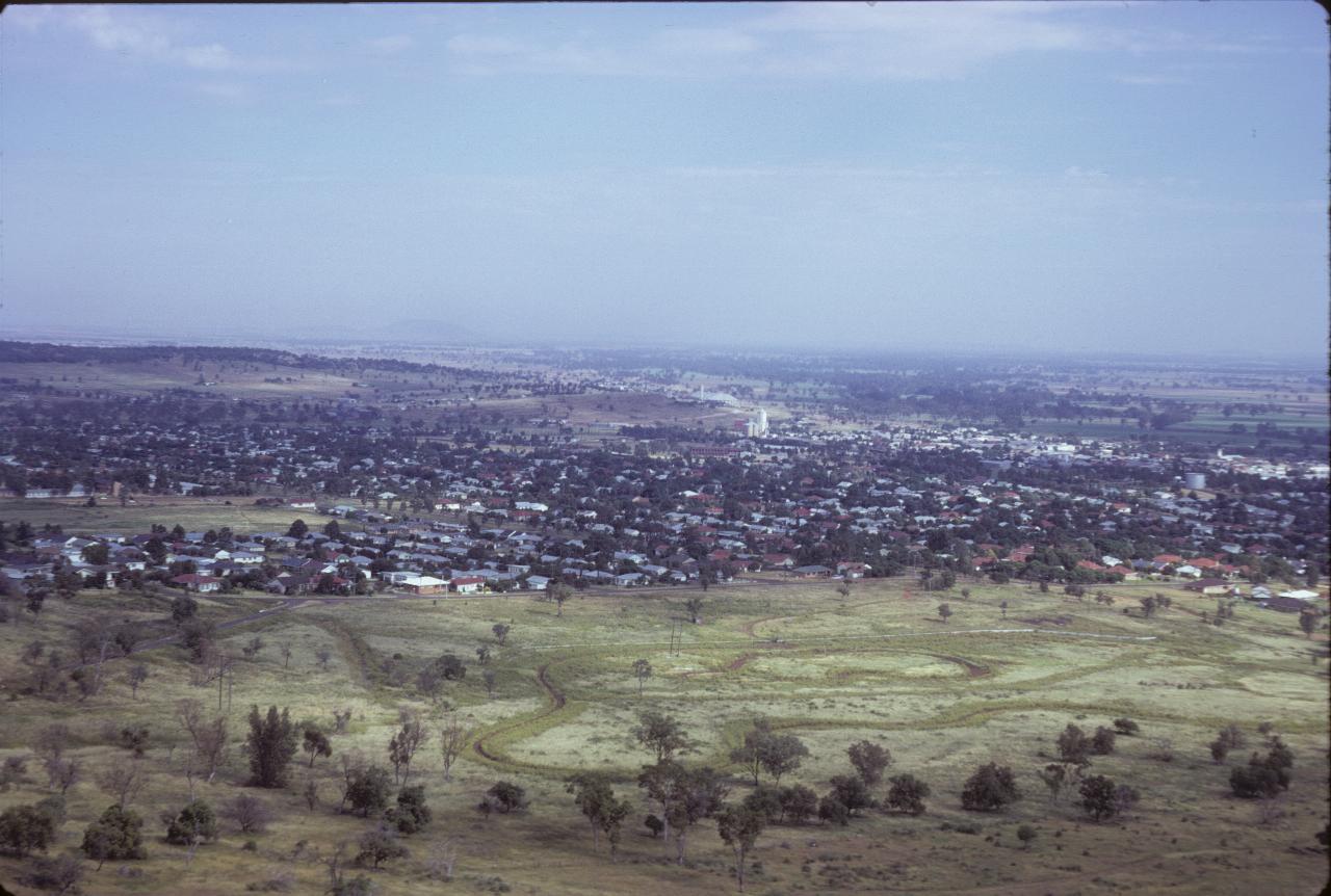 Looking down on town and fields beyond