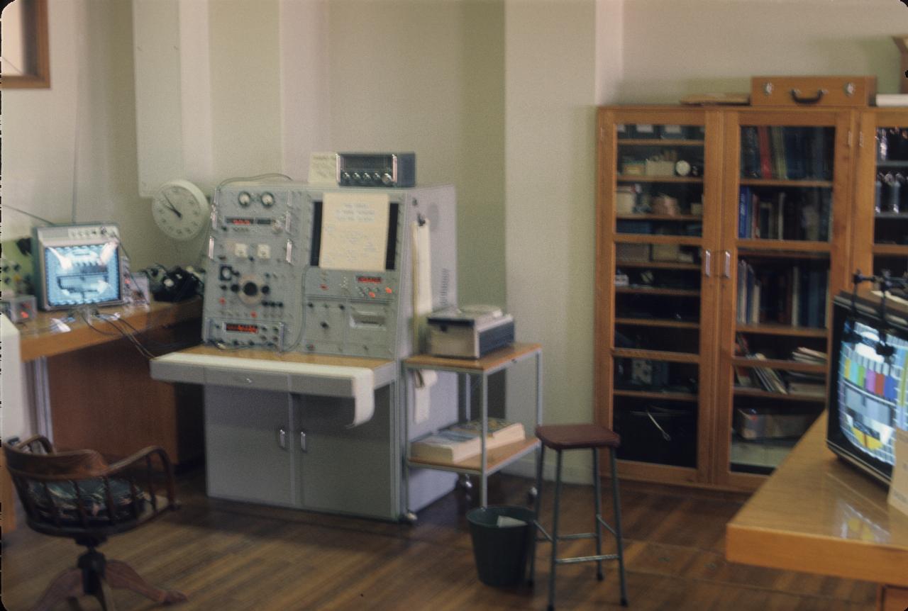 Lab with gray console, cabinets and a couple of TVs