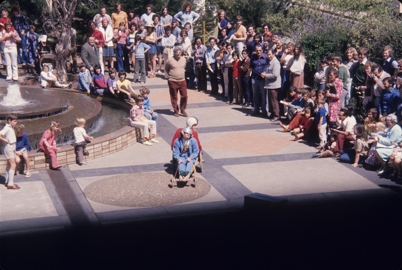 Billy cart style entry, with 2 riders wearing helmets