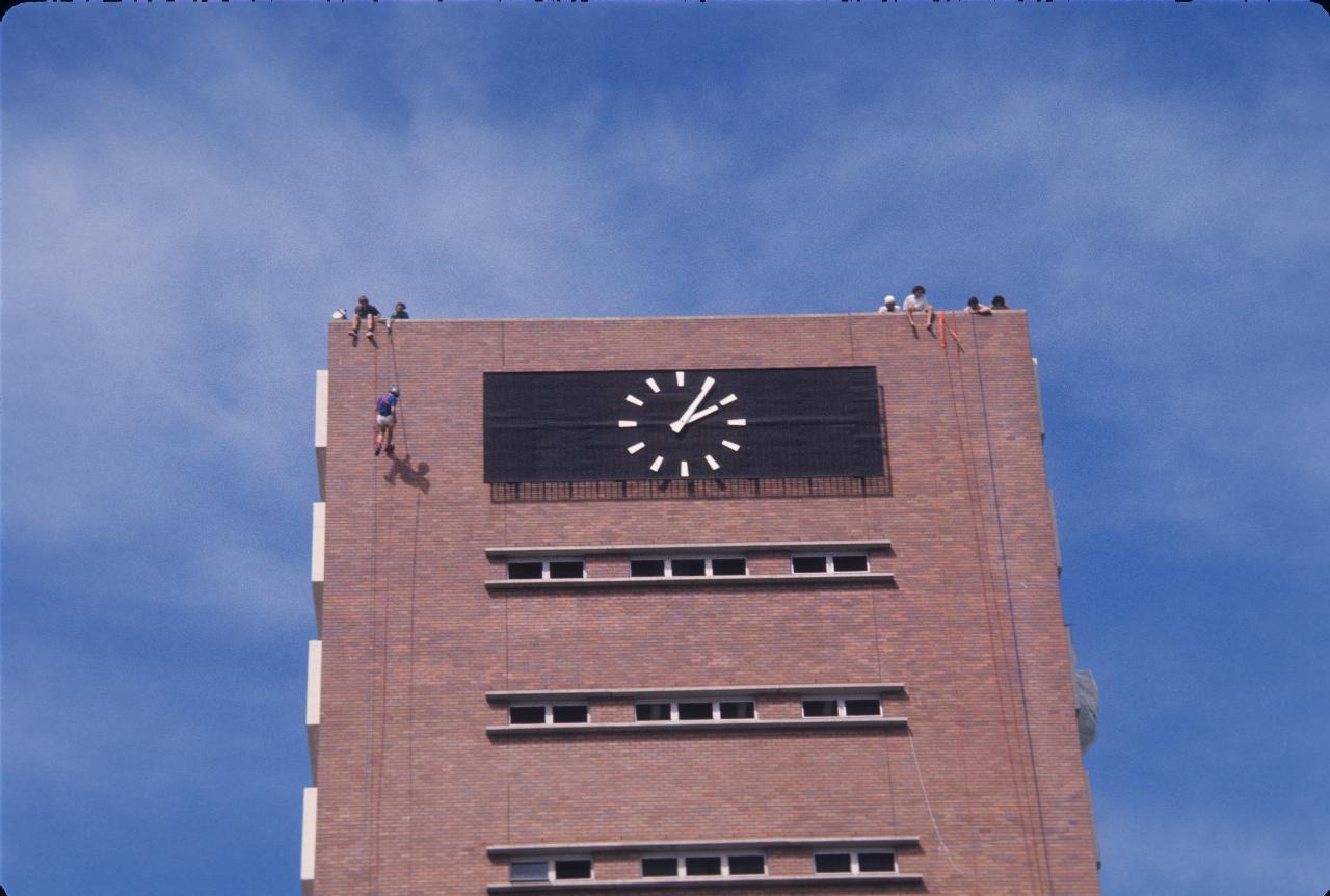 Top of 10 storey building with people on top