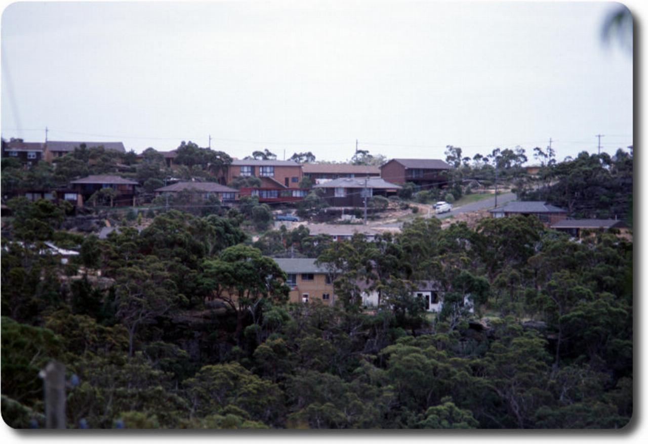 New houses on distant hill side