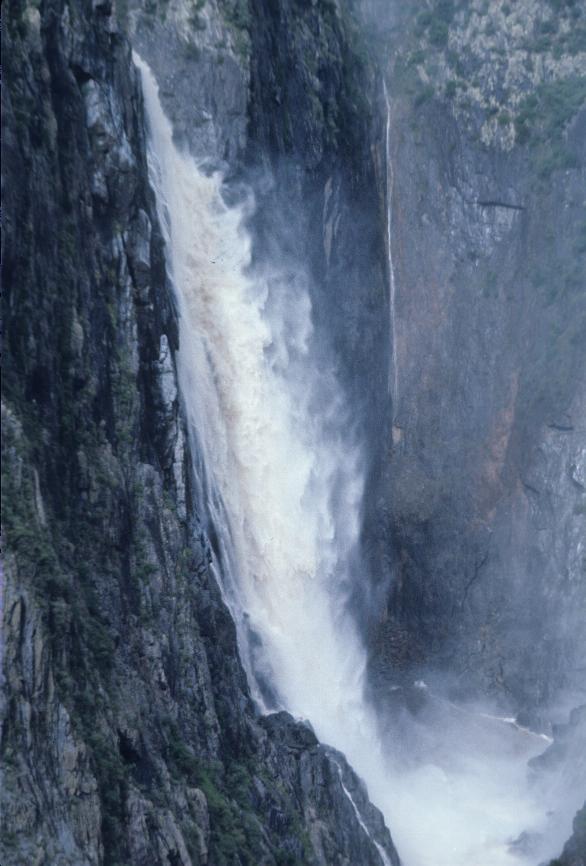 Waterfall over steep cliff, flowing well