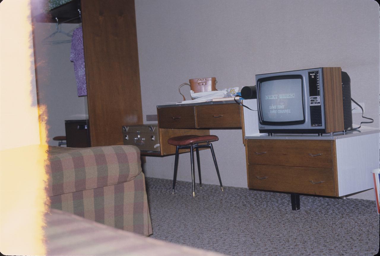 Motel room, showing TV, furniture etc.