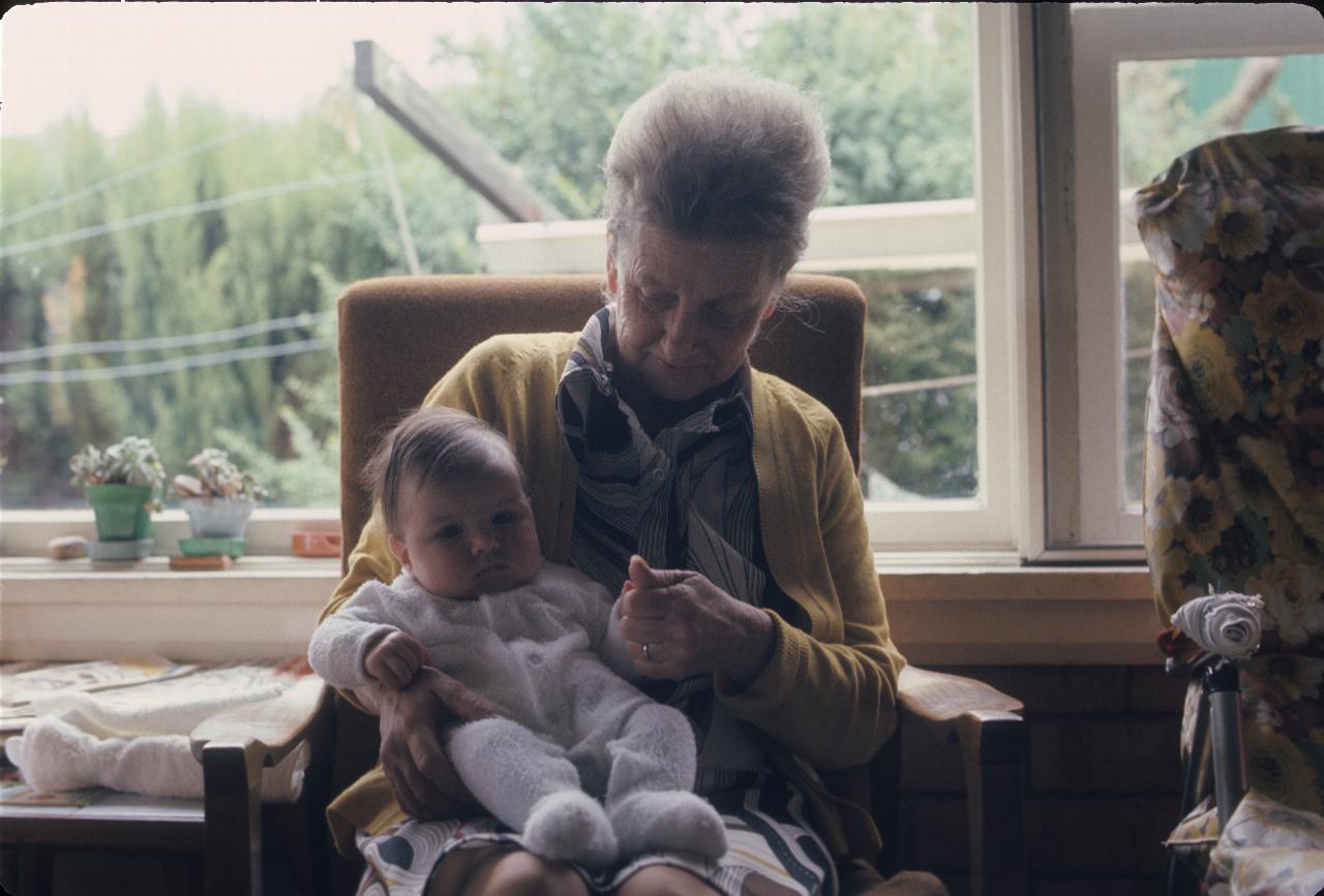 Seated lady holding baby