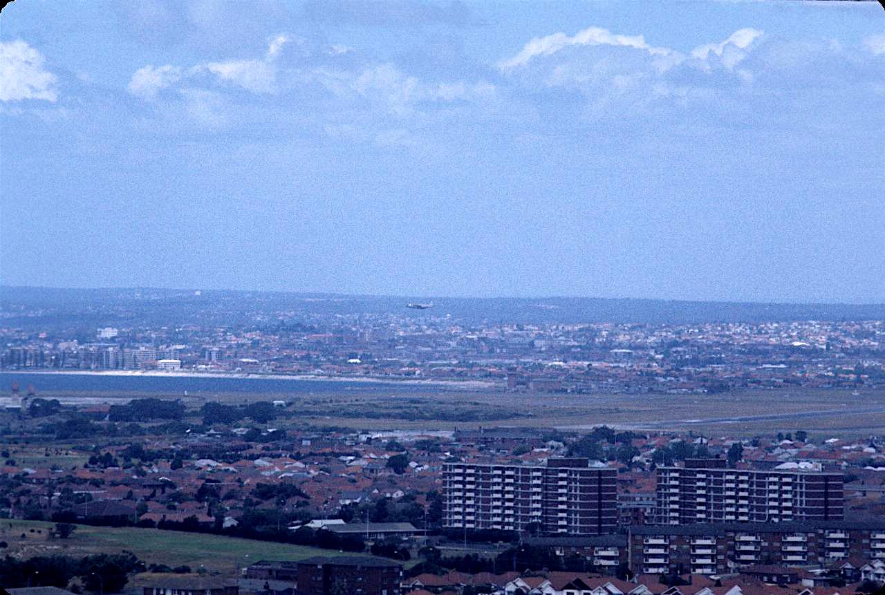 View from the top, including airport, plane, Botany Bay and Lucas Heights