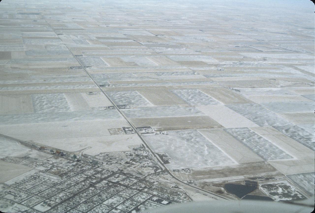 Snow covered settlement between Lethbridge and Calgary, Alberta