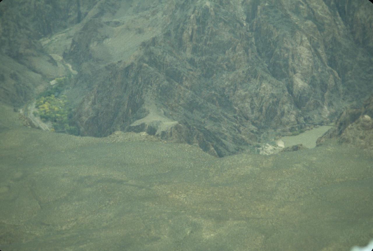 View down into canyon (1500m) showing fall colour and suspension bridge