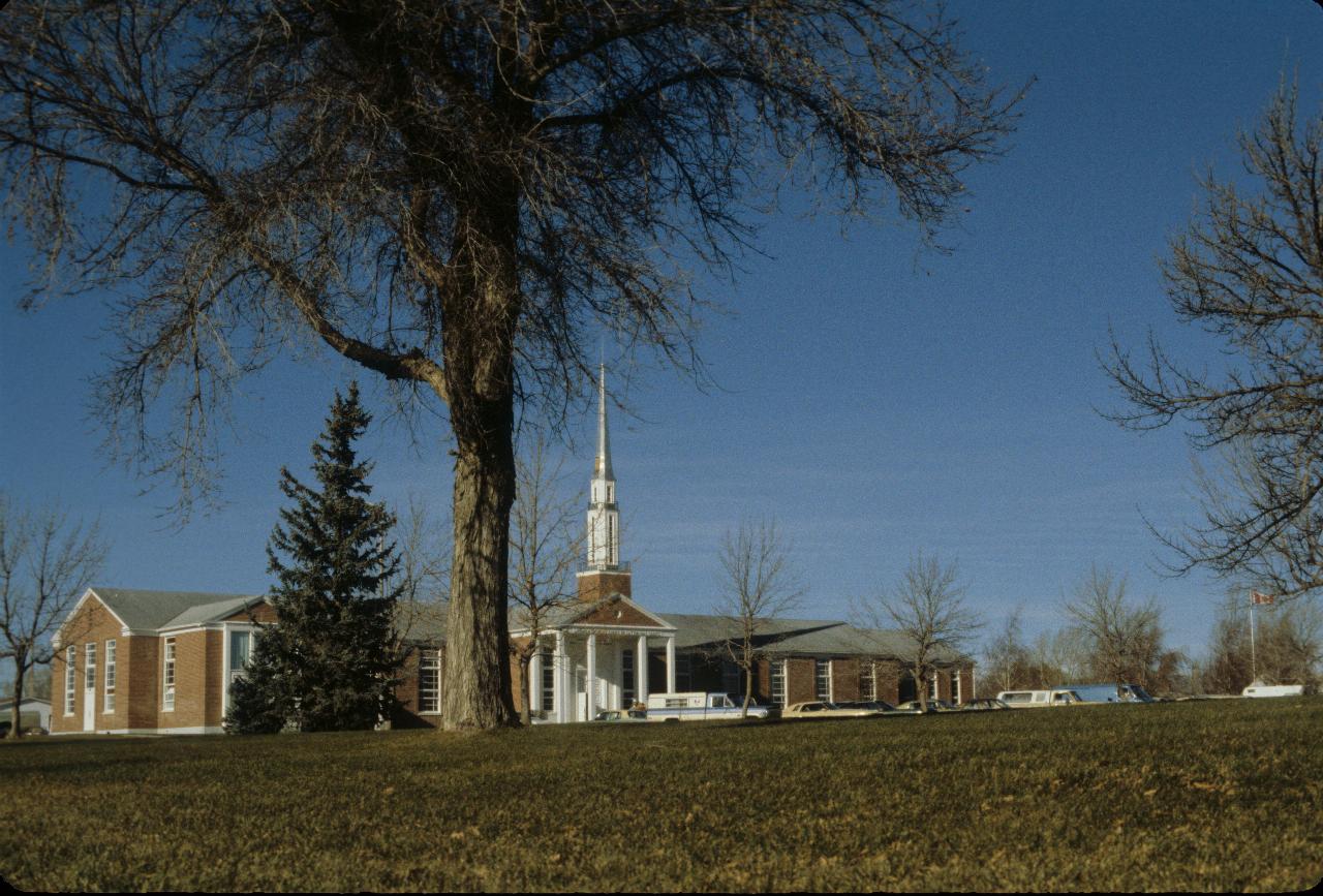 Classic Mormon church, with tall spire relative to rest of building