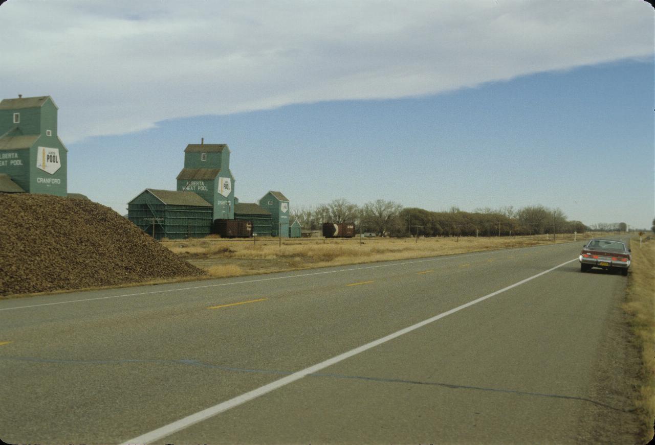 Grain elevators and pile of sugar beets on way to Taber from Lethbridge