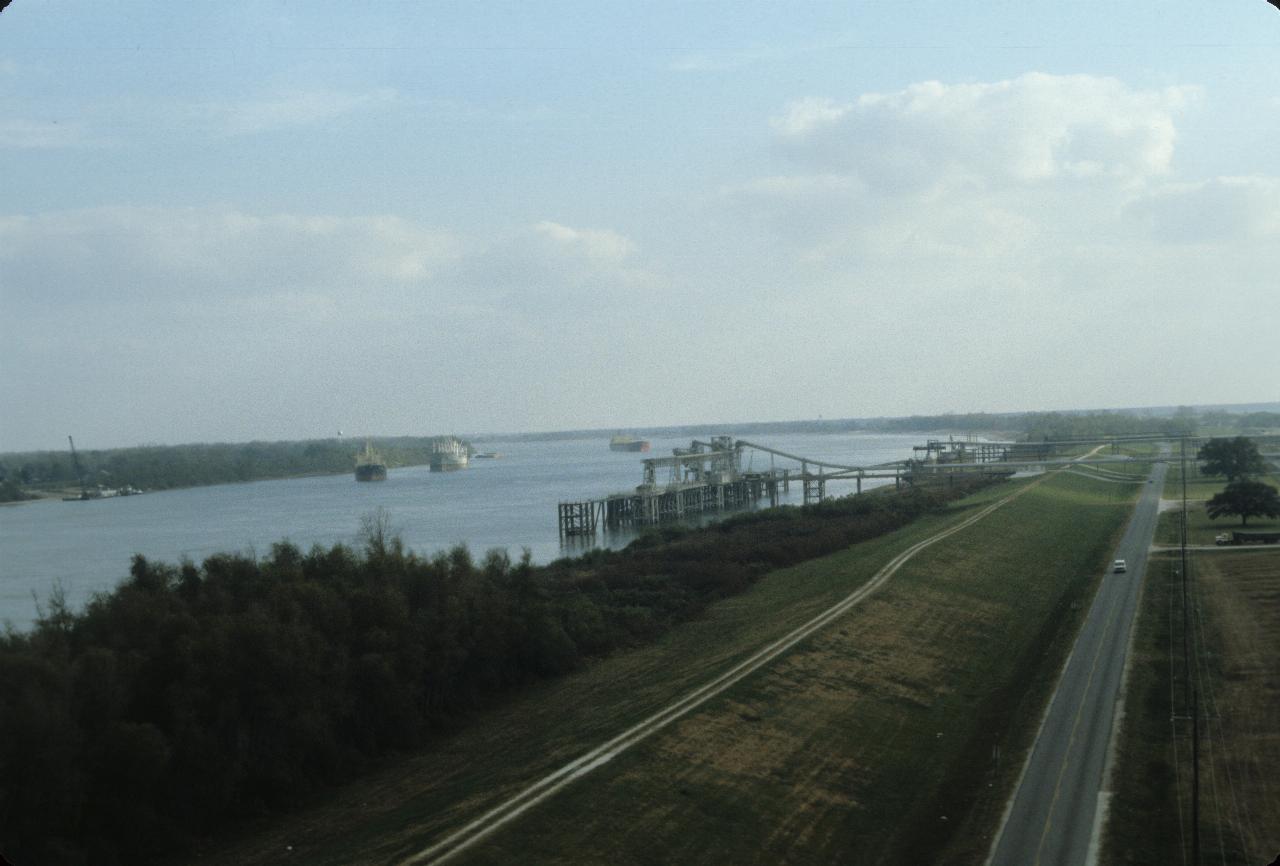 View from bridge of Mississippi, port facilities & levees 80 km upstream from New Orleans