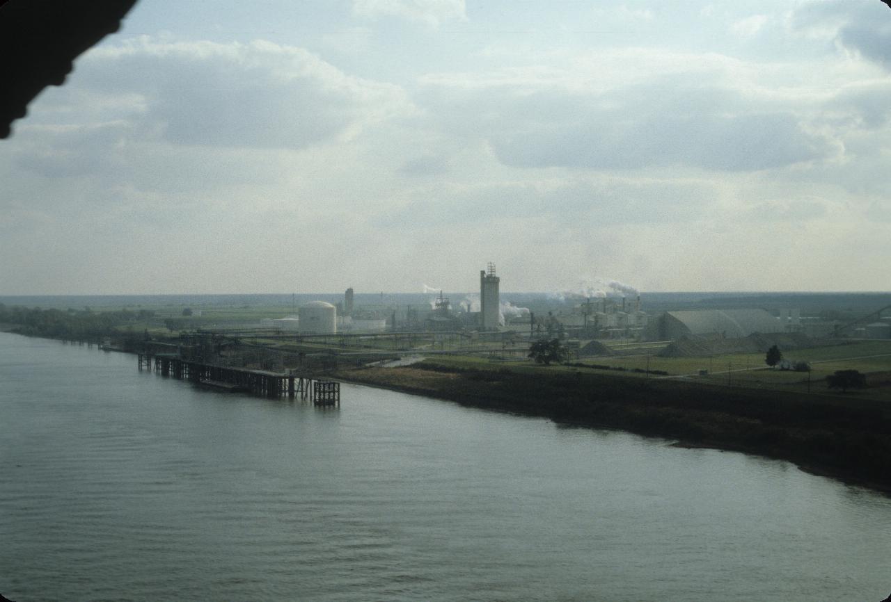 View from bridge of Mississippi, port facilities & levees 80 km upstream from New Orleans