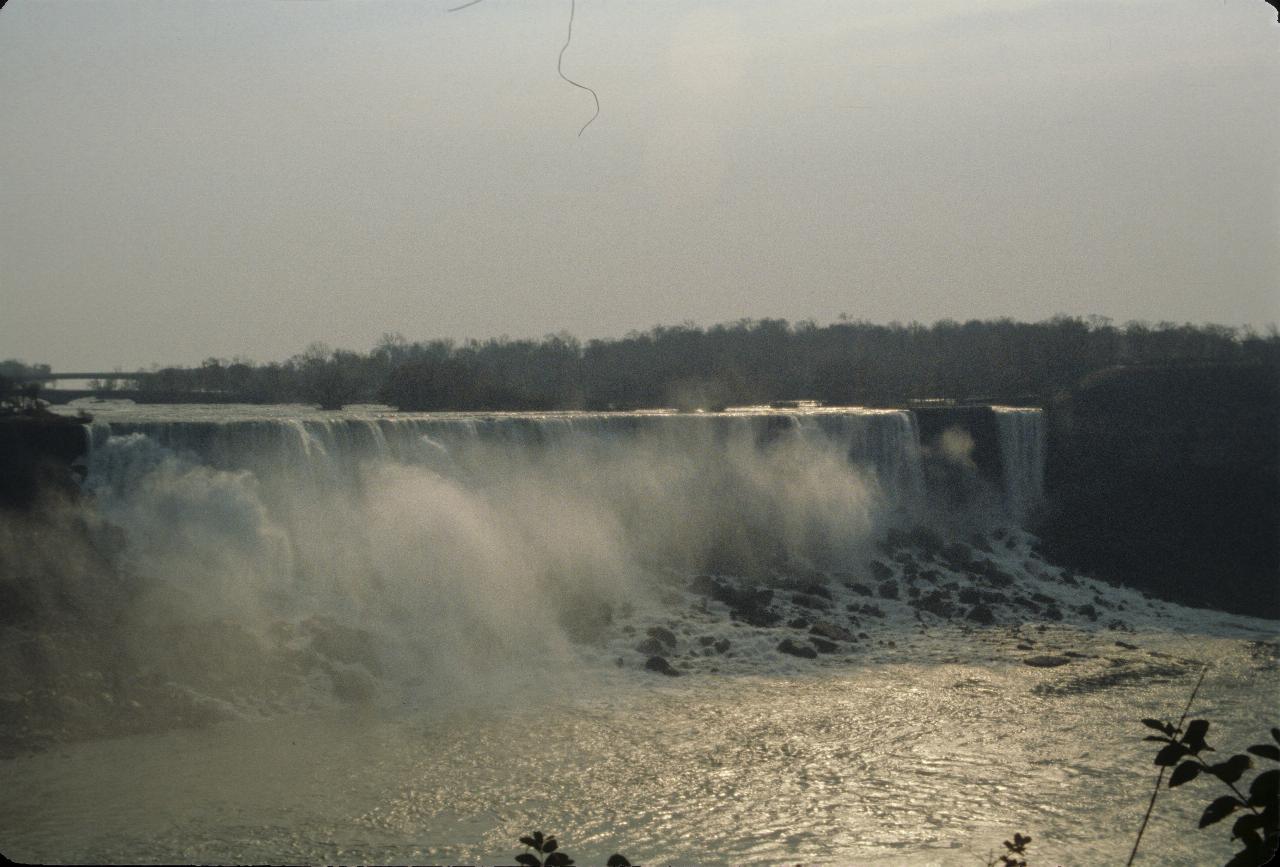 Waterfalls with mist rising from the base