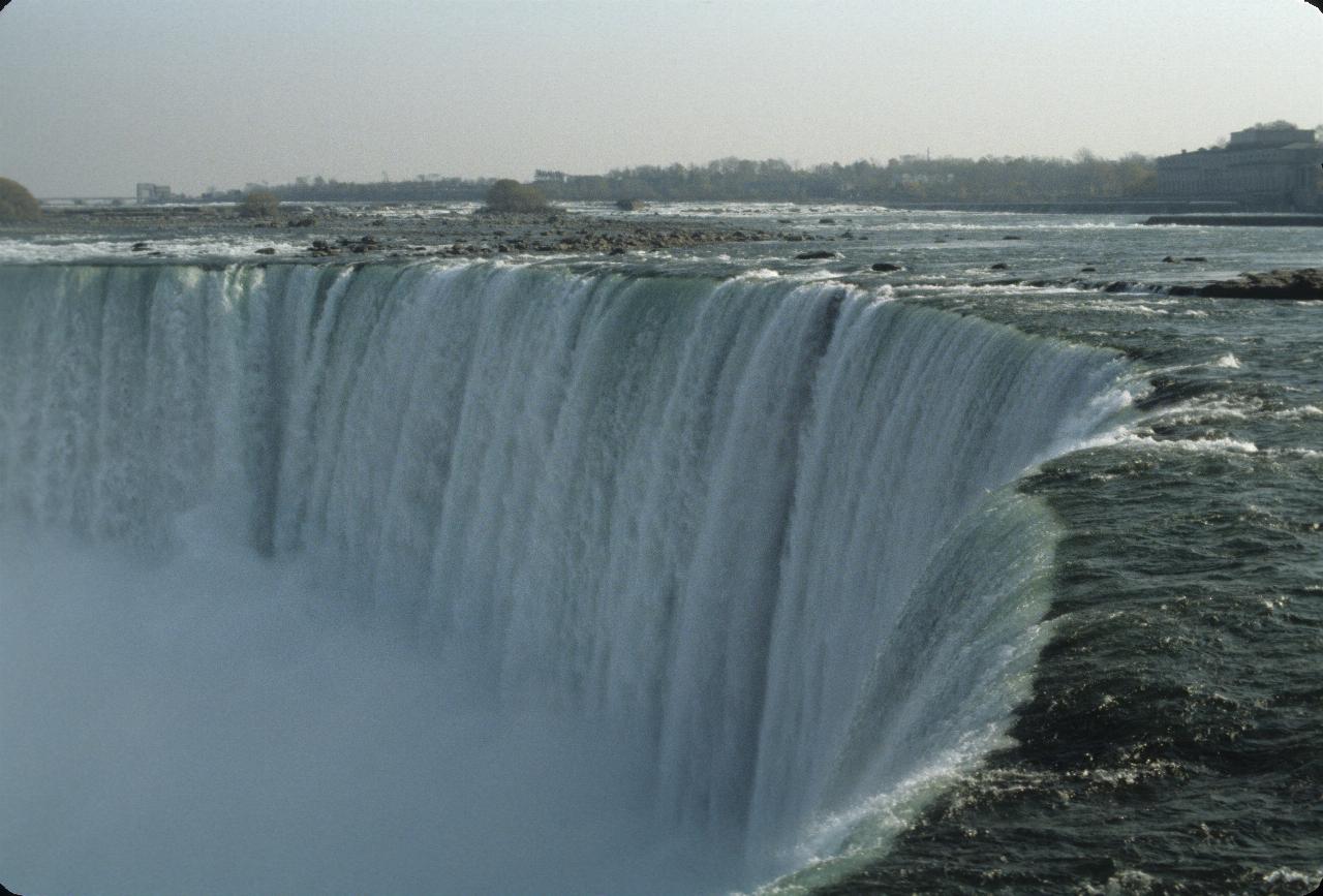 Looking along the top of waterfall, with mist rising from below