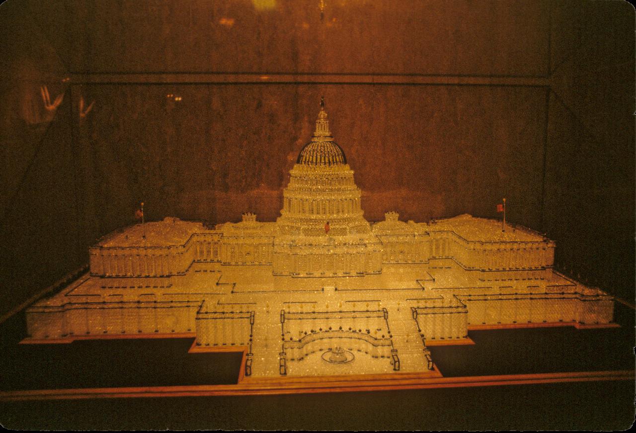 The US Capitol building made of glass, in a display cabinet