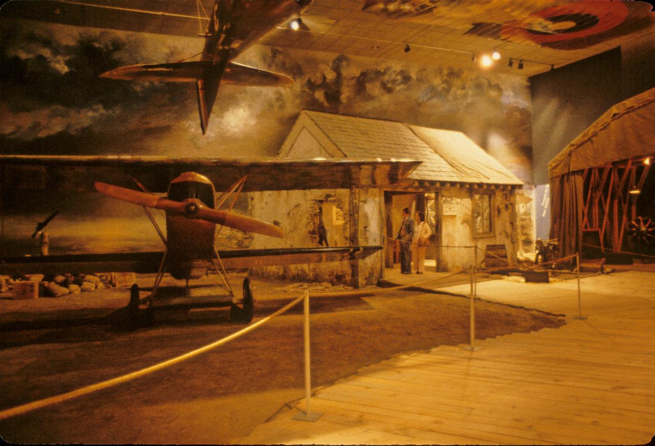 Biplane sitting in front of temporary building