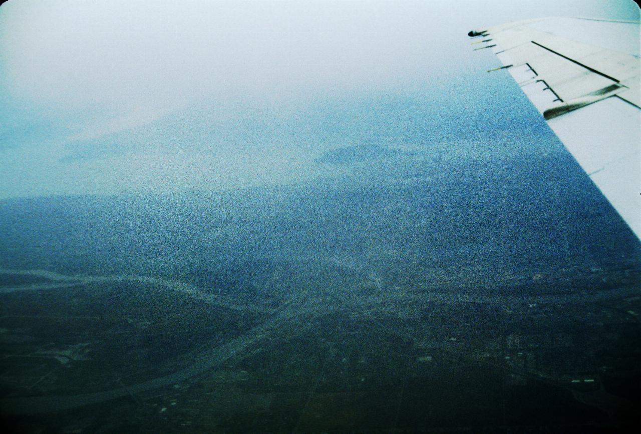 View out aircraft window, showing rivers north and south of Vancouver