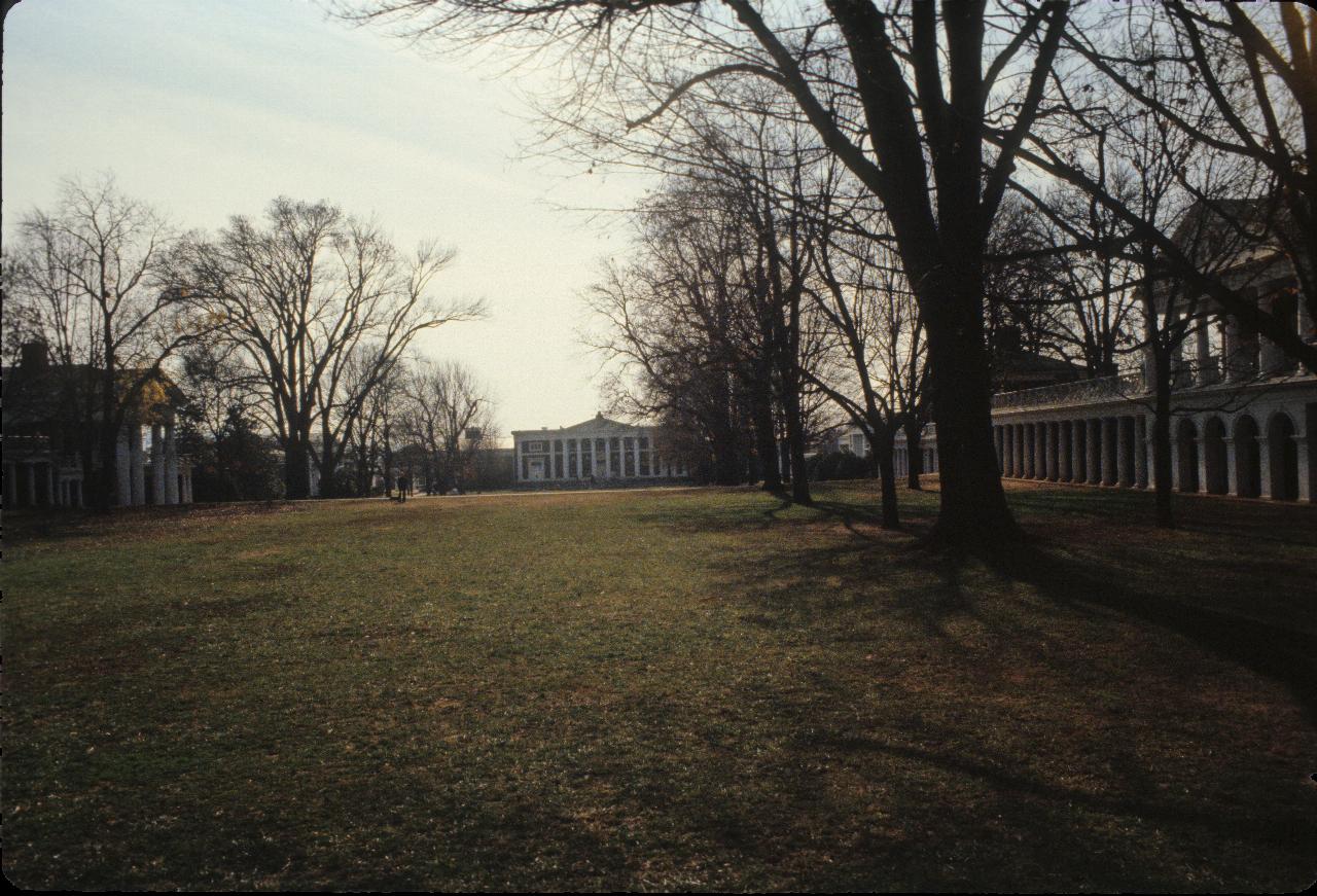 3 sides of a quadrangle, with building at far end with pillars along the front.